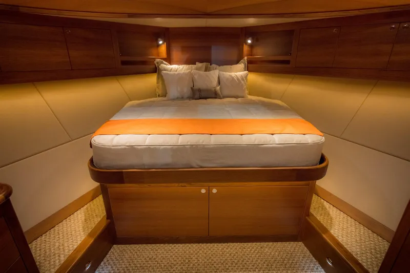 Slide: The Image of Luxurious cabin interior of 2025 Eastbay EB44 yacht with cozy bed and warm lighting. - 7