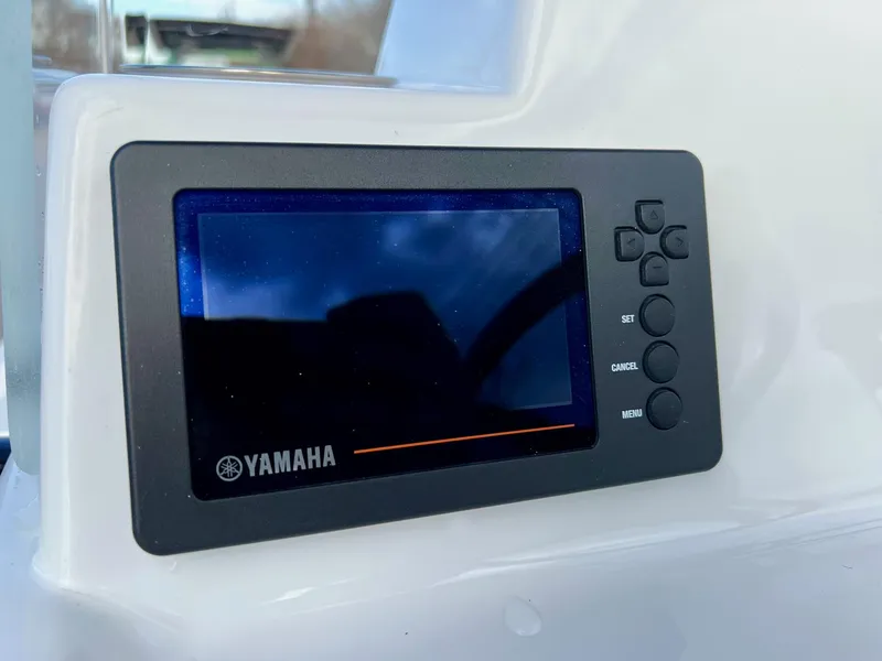 Slide: The Image of Yamaha display panel on 2025 Shallow Sport 24 Sport boat dashboard. - 16