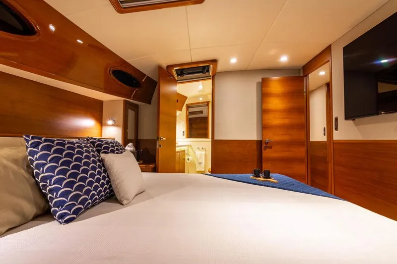 Slide: The Image of Luxurious cabin interior of 2026 Palm Beach Motor Yachts PB65, featuring elegant wood finishes. - 15