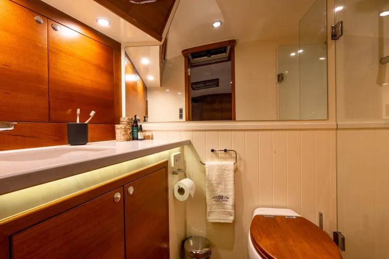 Slide: The Image of Luxurious bathroom in 2026 Palm Beach Motor Yachts PB65, featuring elegant wood cabinetry. - 16