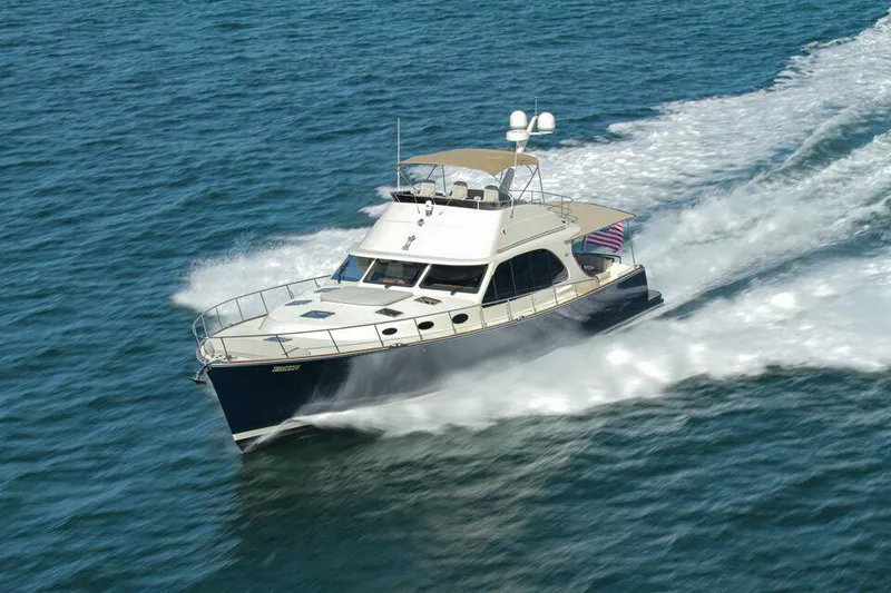 Slide: The Image of 2026 Palm Beach Motor Yachts PB65 cruising on open water, showcasing sleek design and performance. - 26