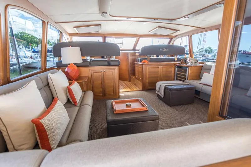 Slide: The Image of Luxurious interior of 2026 Palm Beach Motor Yachts PB65 with elegant seating and wood finishes. - 3