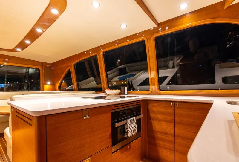 Slide: The Image of Luxurious interior of 2026 Palm Beach Motor Yachts PB65 with elegant wood finishes. - 9