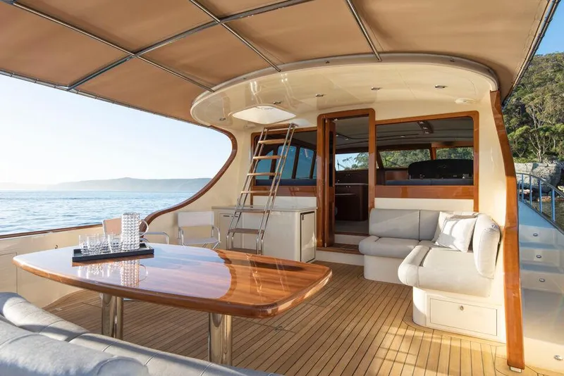 Slide: The Image of Luxurious 2026 Palm Beach Motor Yachts PB65 interior with elegant seating and ocean view. - 1