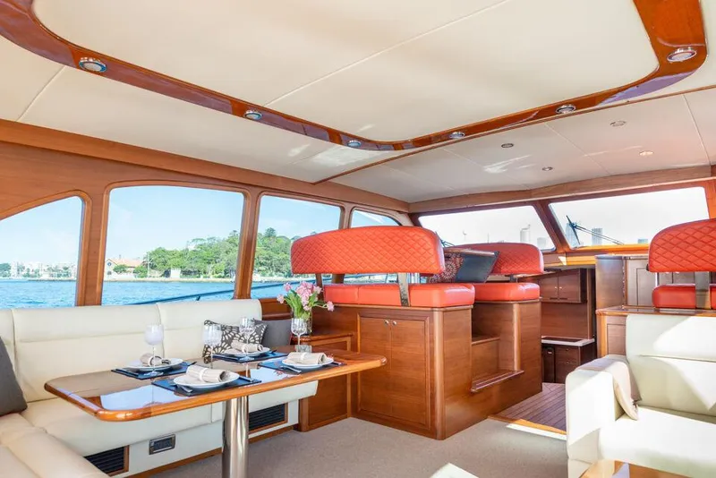 Slide: The Image of Luxurious interior of 2026 Palm Beach Motor Yachts PB65, featuring elegant seating and dining area. - 5