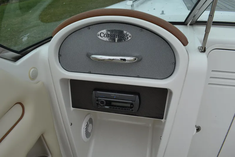 Slide: The Image of 2009 Chris-Craft Corsair 25 dashboard with audio system and speaker. - 13