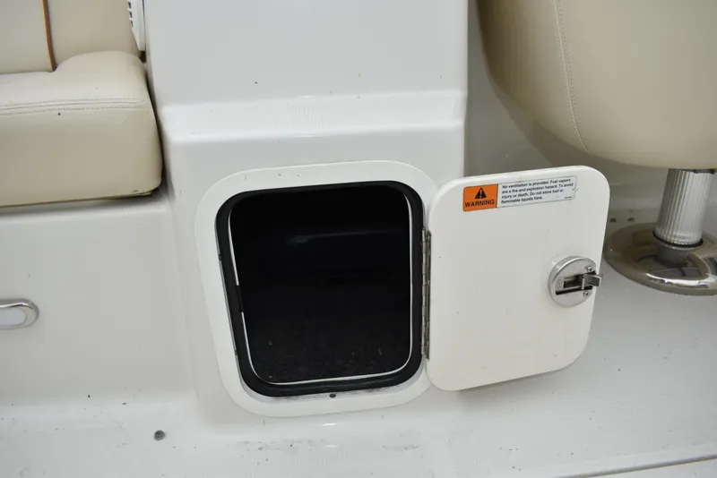 Slide: The Image of Open storage compartment on 2009 Chris-Craft Corsair 25 boat interior. - 17
