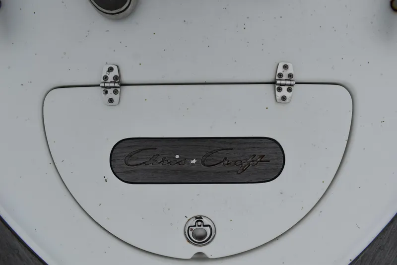 Slide: The Image of 2009 Chris-Craft Corsair 25 boat detail with logo and hinges. - 27