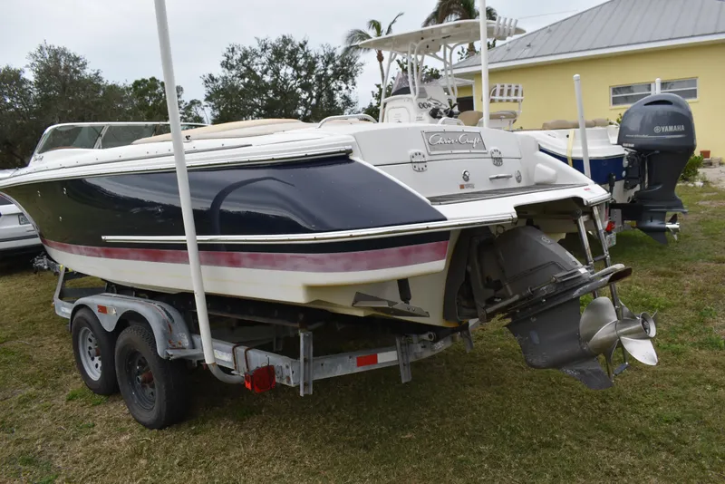 Slide: The Image of 2009 Chris-Craft Corsair 25 boat on trailer, parked outdoors. - 6
