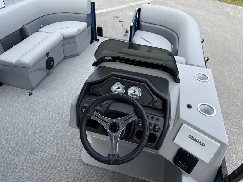 Slide: The Image of 2025 Bentley Pontoons 20 Legacy interior with steering wheel and seating. - 12