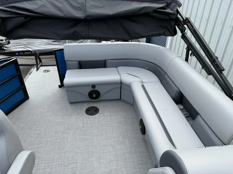 Slide: The Image of 2025 Bentley Pontoons 20 Legacy interior with gray seating and black canopy. - 13