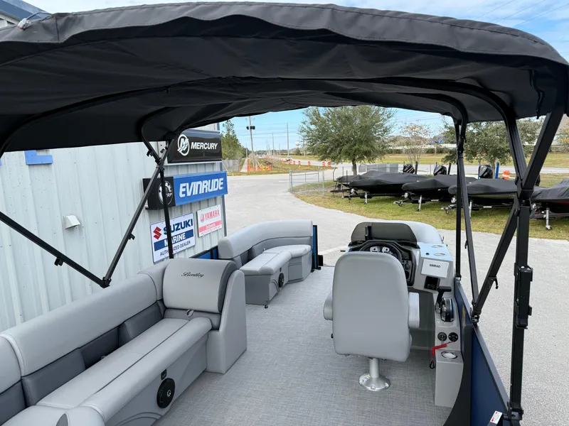 Slide: The Image of 2025 Bentley Pontoons 20 Legacy interior with seating and steering console. - 14