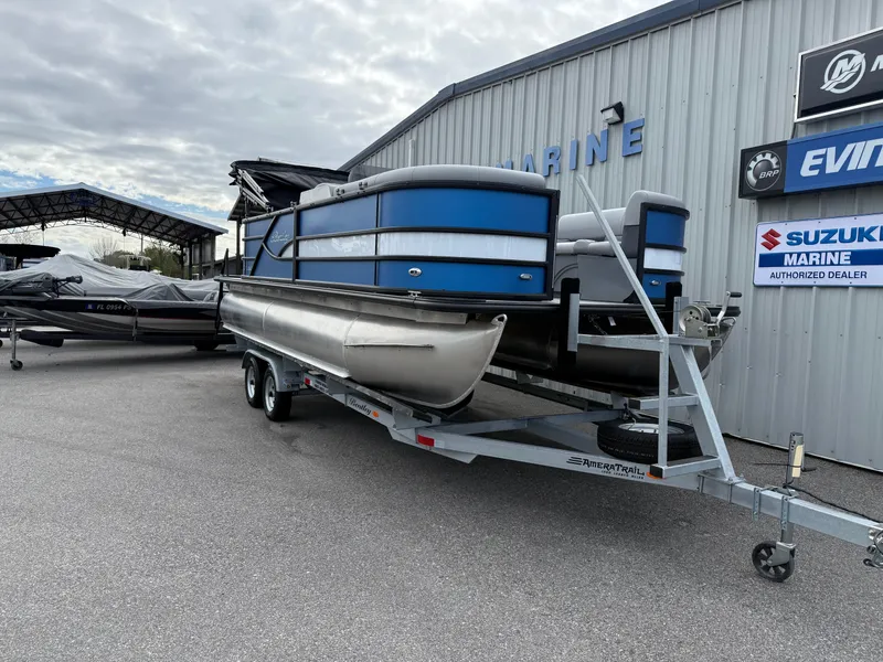 Slide: The Image of 2025 Bentley Pontoons 20 Legacy on trailer at marine dealership. - 3