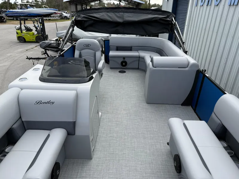 Slide: The Image of 2025 Bentley Pontoons 20 Legacy interior with gray seating and modern design. - 8