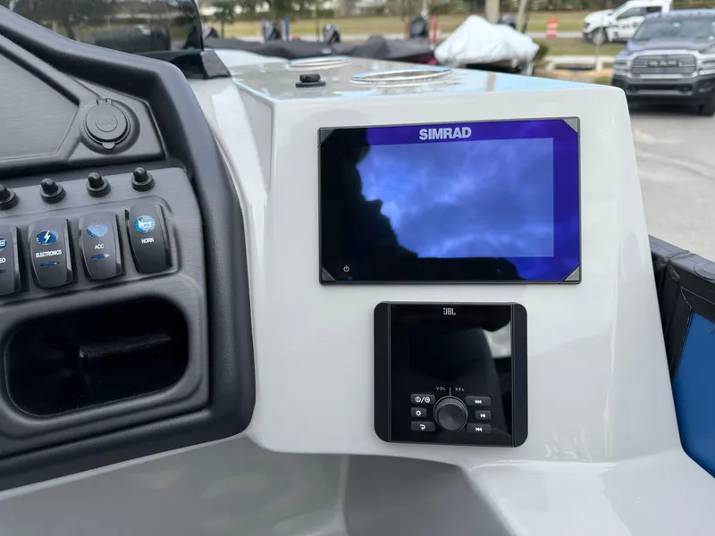 Slide: The Image of Control panel of 2025 Bentley Pontoons 20 Legacy with Simrad display and JBL controls. - 9