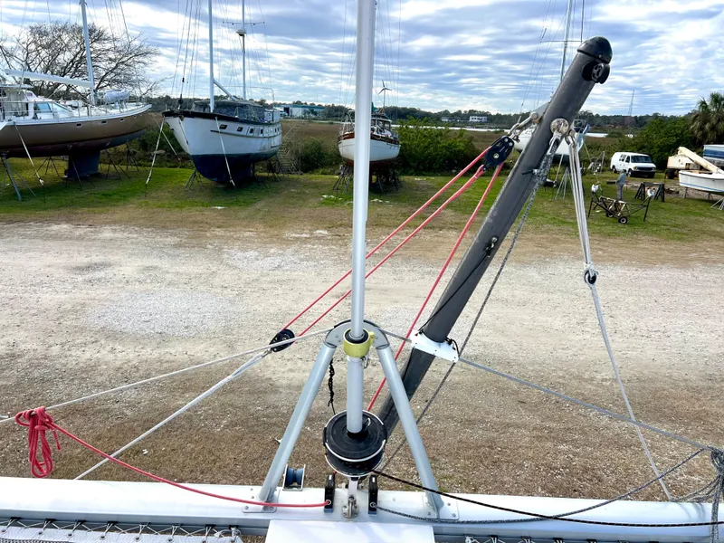 Slide: The Image of 2020 Seawind 1260 catamaran deck with hatches and rigging, docked on land. - 12