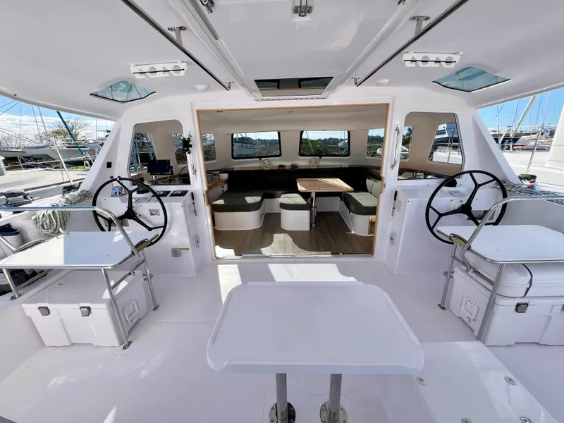 Slide: The Image of Interior of 2020 Seawind 1260 catamaran with modern seating and panoramic windows. - 24