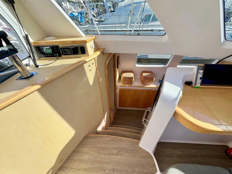 Slide: The Image of Interior of 2020 Seawind 1260 catamaran with wicker cushions and large windows. - 41