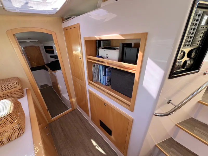 Slide: The Image of Interior cabin of 2020 Seawind 1260 catamaran with cozy bed and wooden accents. - 44