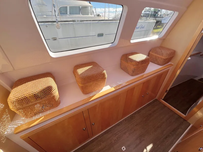 Slide: The Image of Interior of 2020 Seawind 1260 catamaran cabin with modern design and cozy sleeping area. - 45