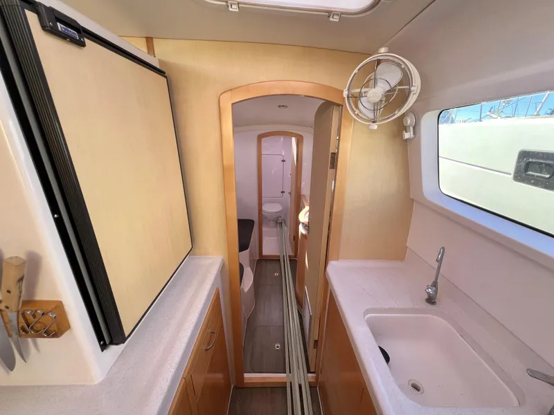 Slide: The Image of Storage area in 2020 Seawind 1260 yacht with life preserver and gear. - 77