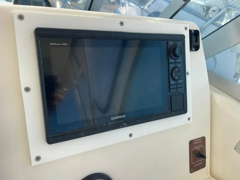 Slide: The Image of Garmin GPS display on 2003 Pursuit 2870 Walkaround boat dashboard. - 15