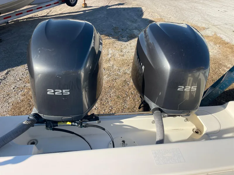 Slide: The Image of Twin 225 horsepower outboard motors on a 2003 Pursuit 2870 Walkaround boat. - 20