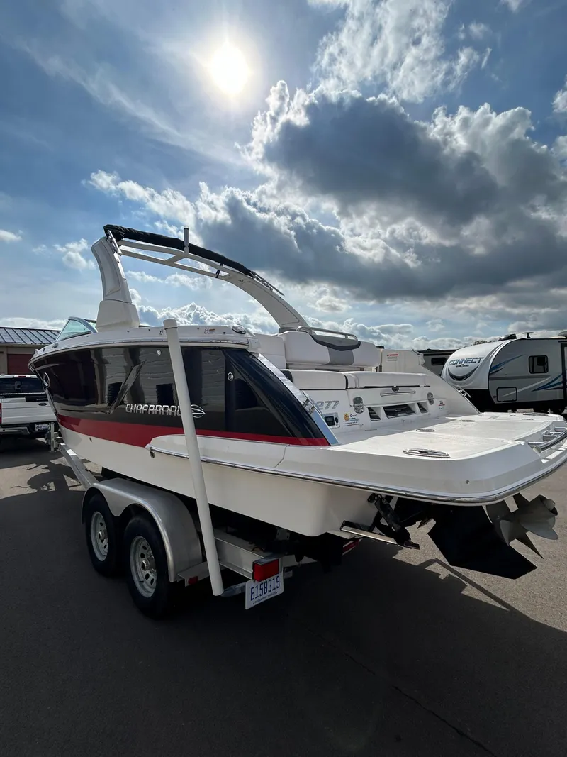 Slide: The Image of 2019 Chaparral 277 SSX boat on trailer under cloudy sky. - 14