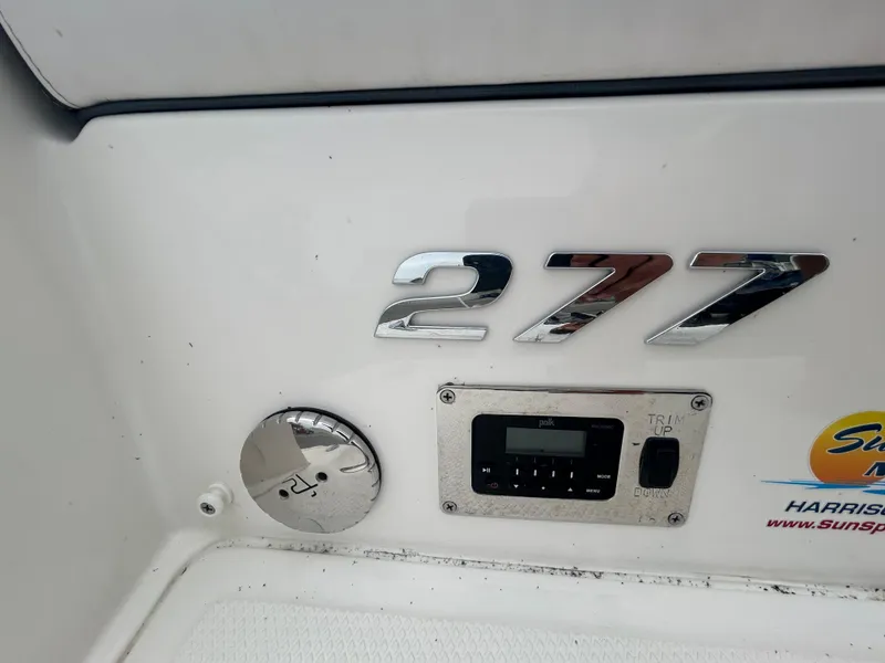 Slide: The Image of 2019 Chaparral 277 SSX boat dashboard with control panel and logo. - 17