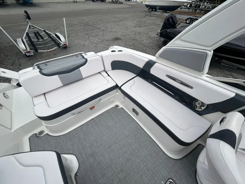 Slide: The Image of 2019 Chaparral 277 SSX boat interior with white and black seating. - 18