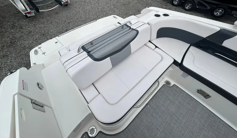 Slide: The Image of 2019 Chaparral 277 SSX boat interior with white seating and sleek design. - 19