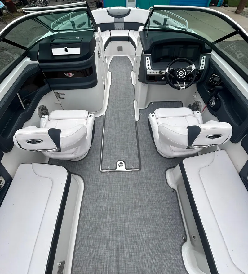Slide: The Image of 2019 Chaparral 277 SSX boat interior with sleek seating and modern dashboard design. - 20