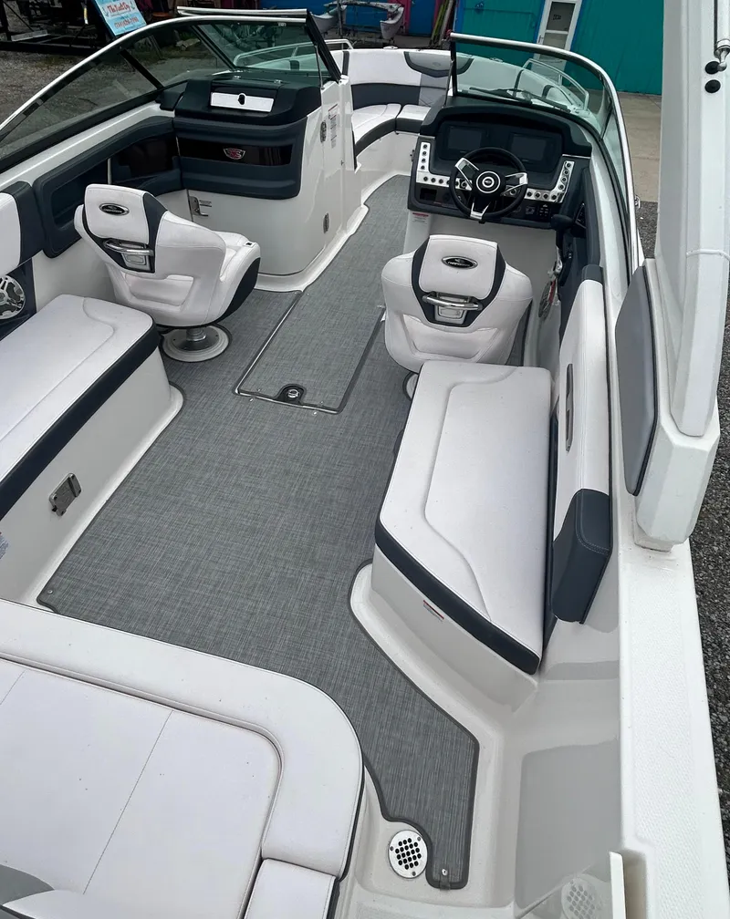 Slide: The Image of 2019 Chaparral 277 SSX boat interior with sleek seating and modern dashboard design. - 21