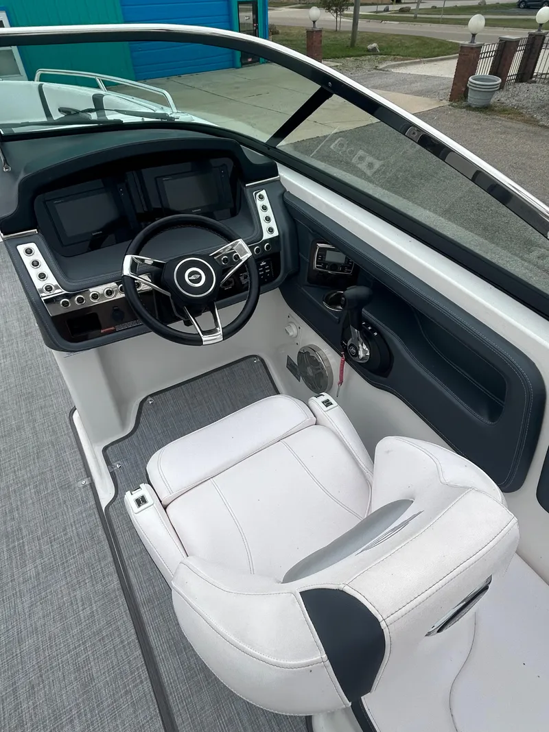 Slide: The Image of 2019 Chaparral 277 SSX boat cockpit with modern steering and controls. - 22