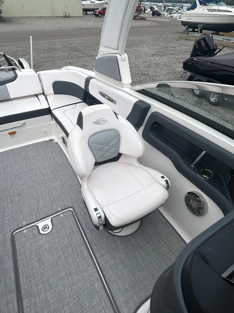 Slide: The Image of 2019 Chaparral 277 SSX boat interior with white seating and gray accents. - 24
