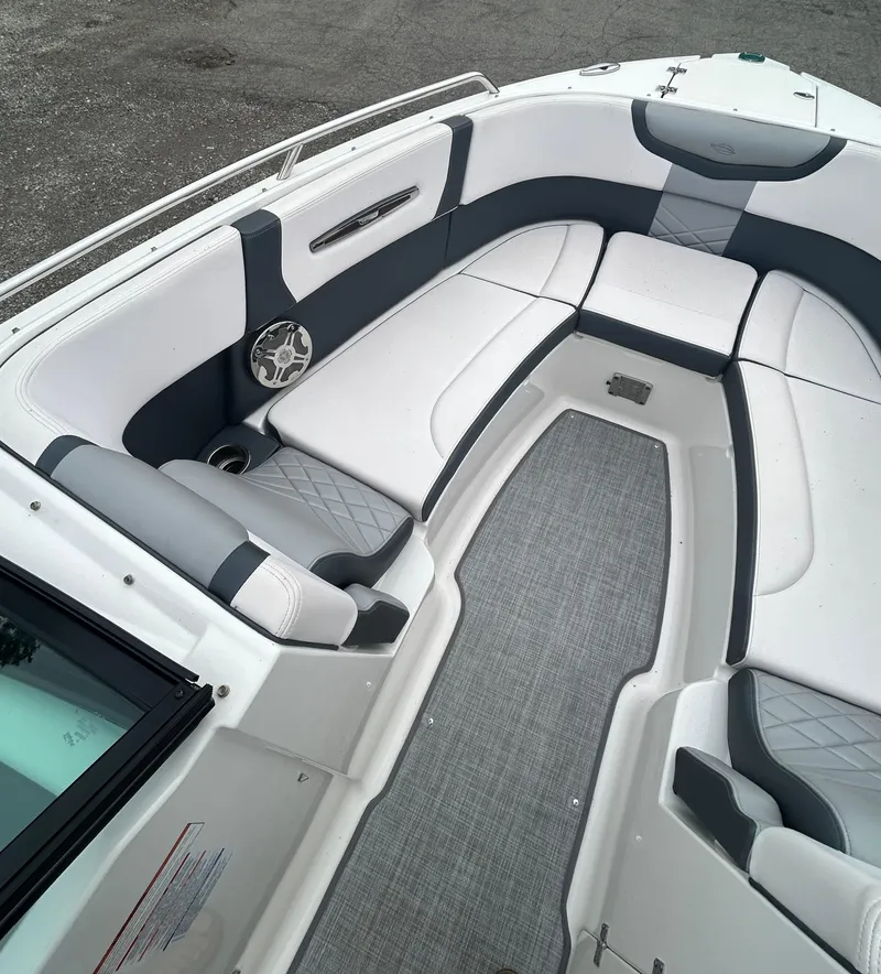 Slide: The Image of 2019 Chaparral 277 SSX boat interior with white and gray seating. - 27
