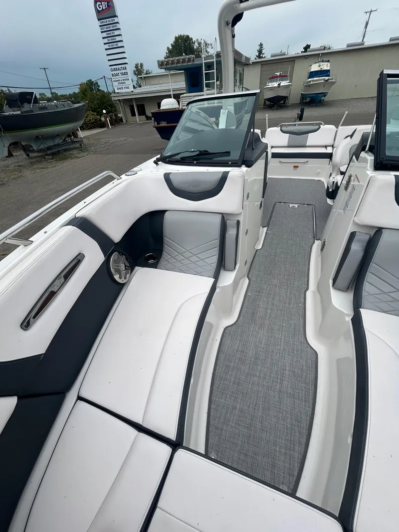 Slide: The Image of 2019 Chaparral 277 SSX boat interior with sleek seating and modern design. - 29