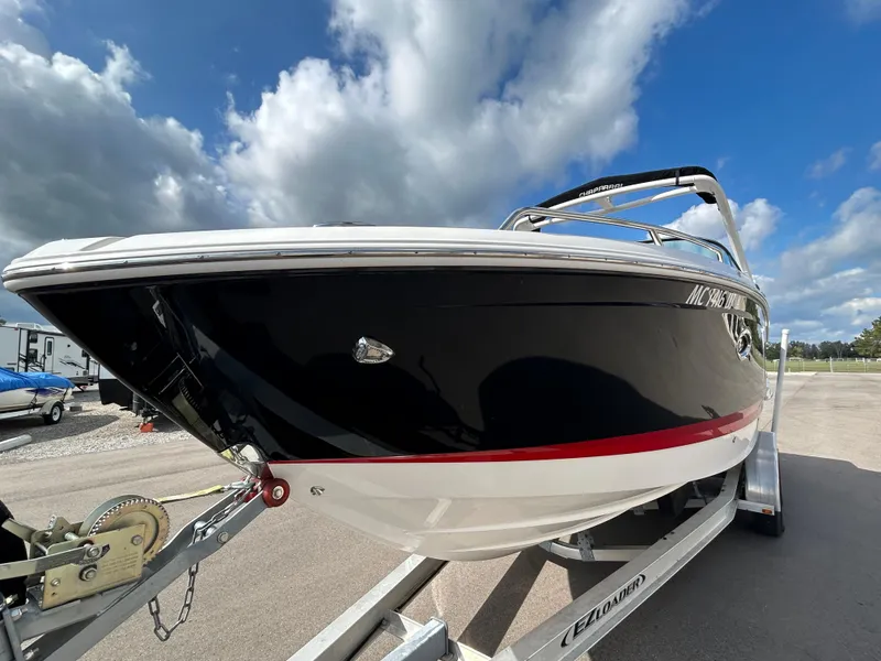 Slide: The Image of 2019 Chaparral 277 SSX boat on trailer under cloudy sky. - 6
