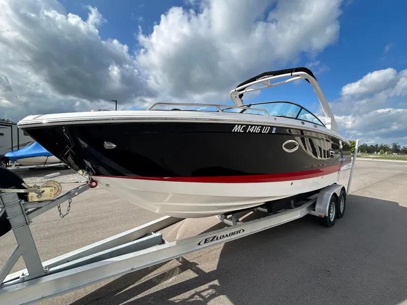 Slide: The Image of 2019 Chaparral 277 SSX boat on trailer under cloudy sky. - 7