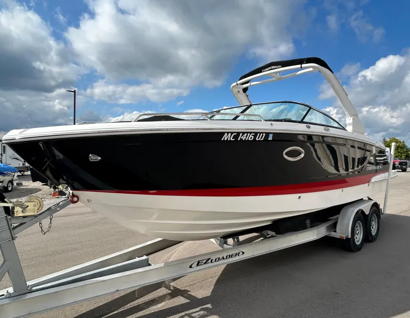 Slide: The Image of 2019 Chaparral 277 SSX boat on trailer under cloudy sky. - 8