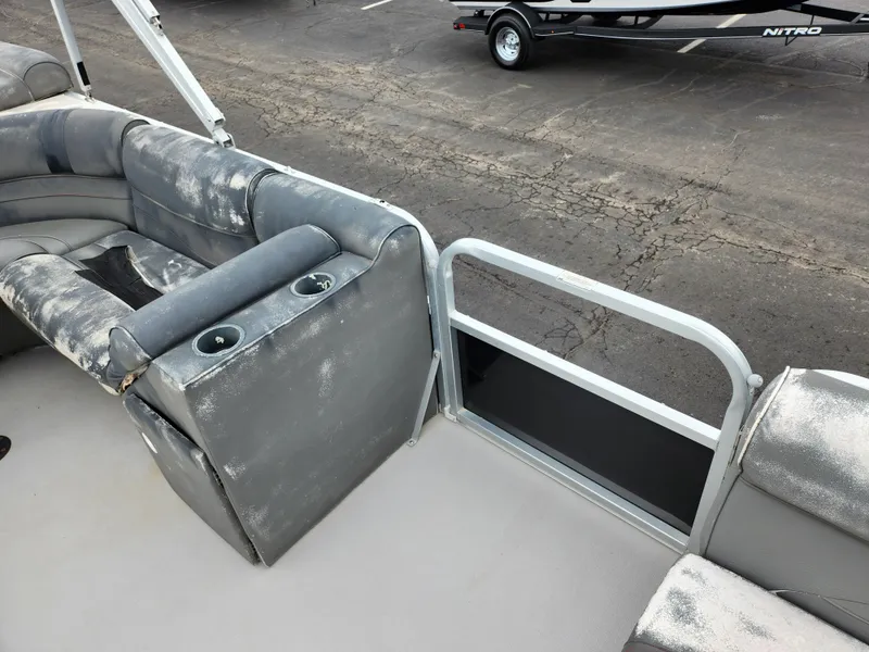 Slide: The Image of Interior of 2010 Misty Harbor 2085CR Adventure Cruiser with gray seating and cup holders. - 10