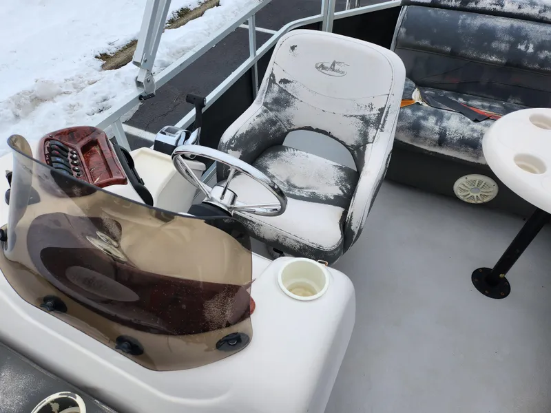 Slide: The Image of 2010 Misty Harbor 2085CR Adventure Cruiser interior with snow-covered seats and steering wheel. - 12