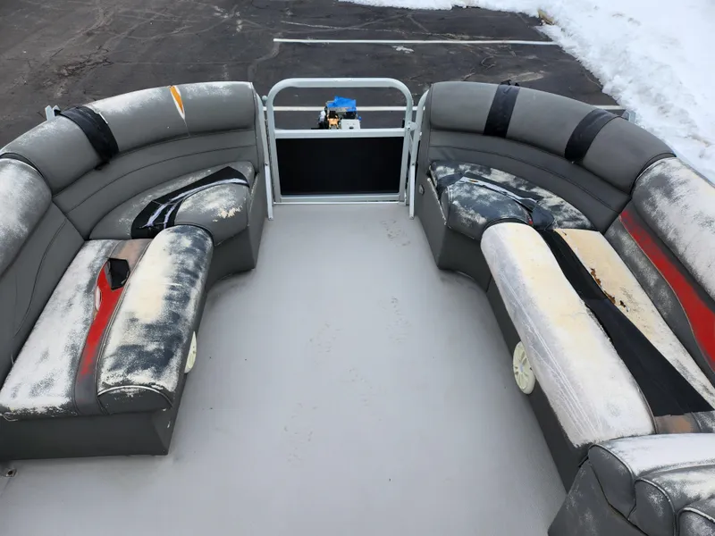 Slide: The Image of 2010 Misty Harbor 2085CR Adventure Cruiser interior with worn seating and snowy background. - 18