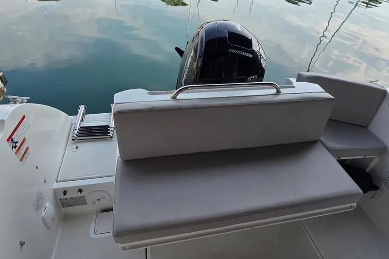 Slide: The Image of Beneteau Antares 7 (2022) boat with Mercury engine and cushioned seating. - 12