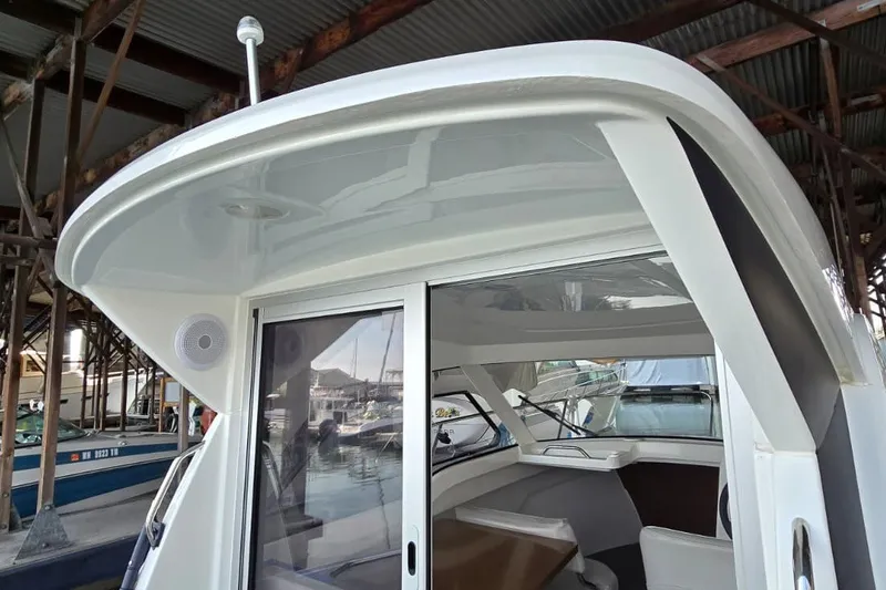 Slide: The Image of 2022 Beneteau Antares 7 boat cabin with sliding glass door and sleek design. - 8