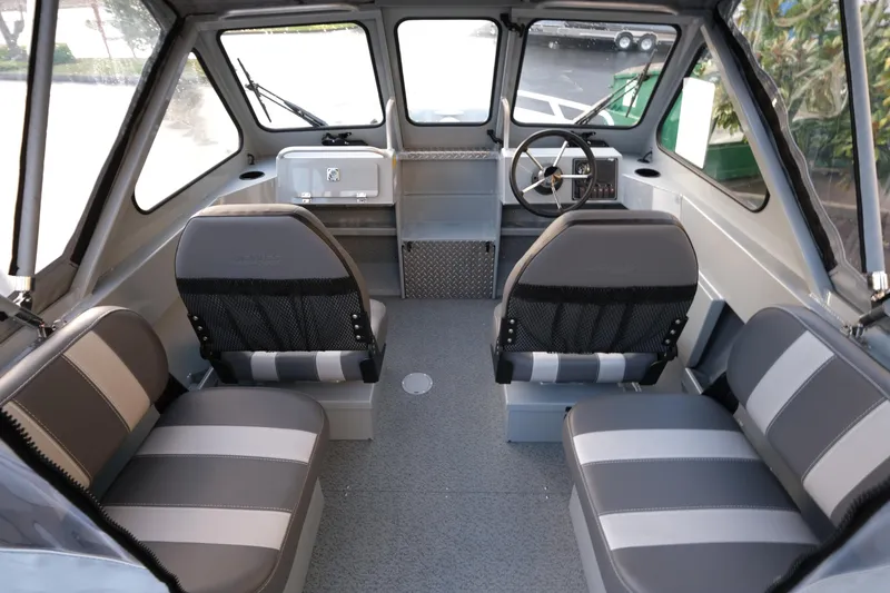 Slide: The Image of 2025 Hewescraft 180 Sportsman interior with seating and steering wheel. - 8