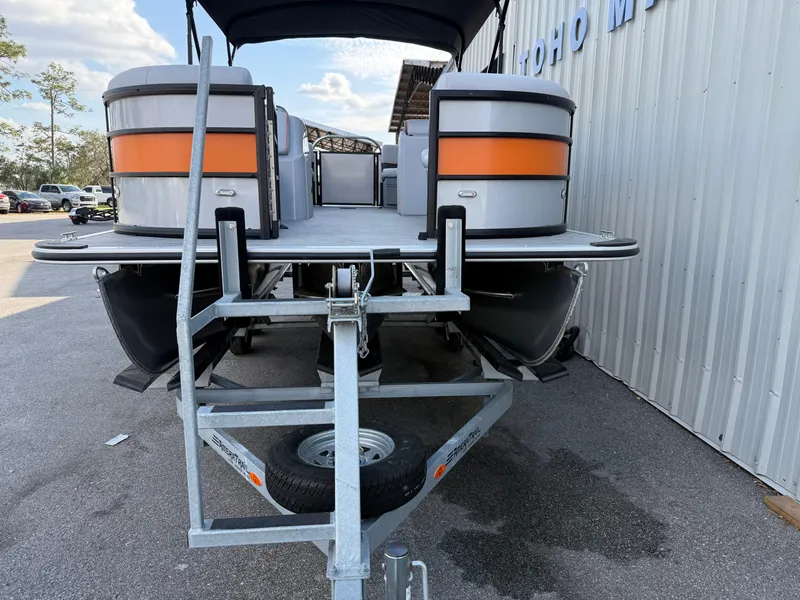 Slide: The Image of 2025 Bentley Pontoons Bolt 203 on trailer, parked outdoors near a building. - 13