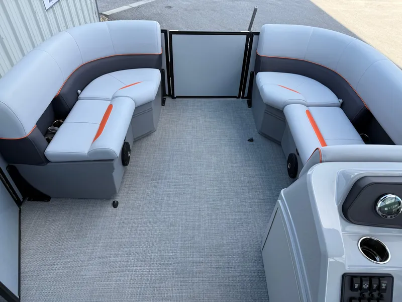 Slide: The Image of 2025 Bentley Pontoons Bolt 203 interior with gray seating and orange accents. - 19