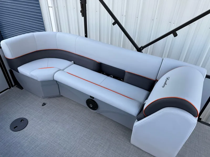 Slide: The Image of 2025 Bentley Pontoons Bolt 203 interior seating with sleek gray upholstery and orange accents. - 20