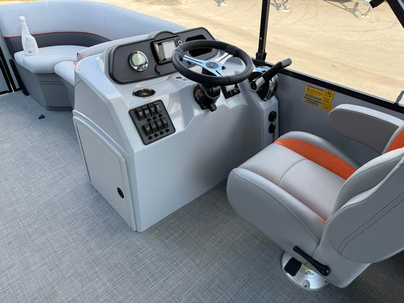 Slide: The Image of 2025 Bentley Pontoons Bolt 203 interior with steering console and seating. - 22
